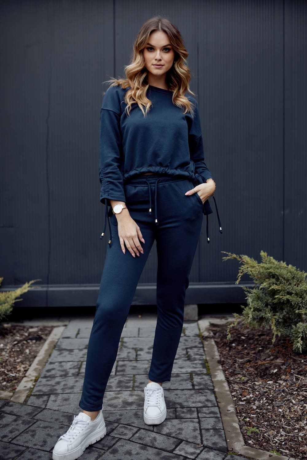 Smooth women's tracksuit with an asymmetric sweatshirt, navy blue