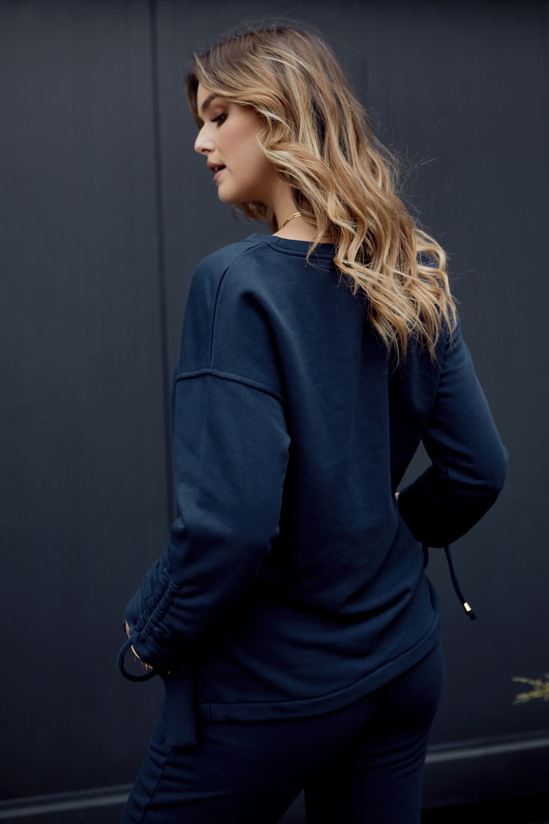 Smooth women's tracksuit with an asymmetric sweatshirt, navy blue